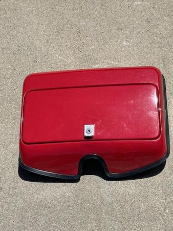 This is a photograph of a vespa p200 glove box sold