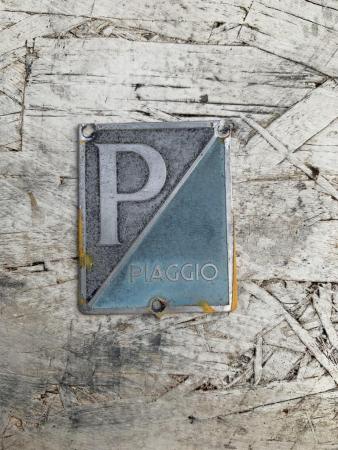 This is an image of a vespa piaggio horncast badge