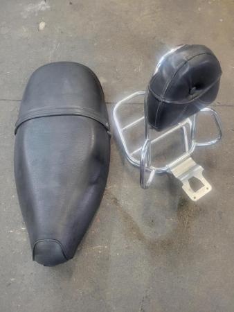 This is an image of a vespa et4 oem black seat and rear rack
