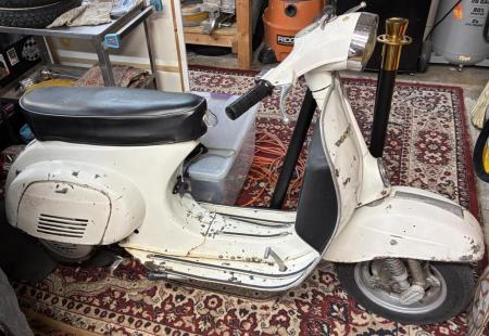 This is a depiction of a 1978 vespa 50 special w/ 135cc malossi kit