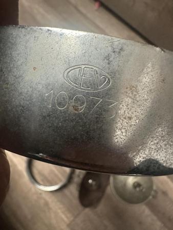 This is an image of a vespa cev headlight rim 
